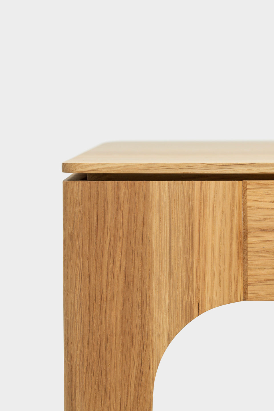 Floating tabletop effect with shadow gap and curved legs.